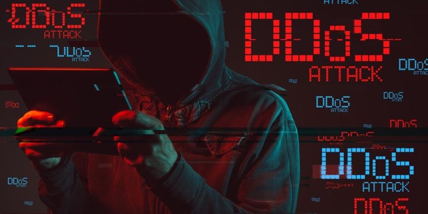 Distributed denial of service or DDoS attack concept with faceless hooded male person using tablet computer, low key red and blue lit image and digital glitch effect (Distributed denial of service or DDoS attack concept with faceless hooded male perso